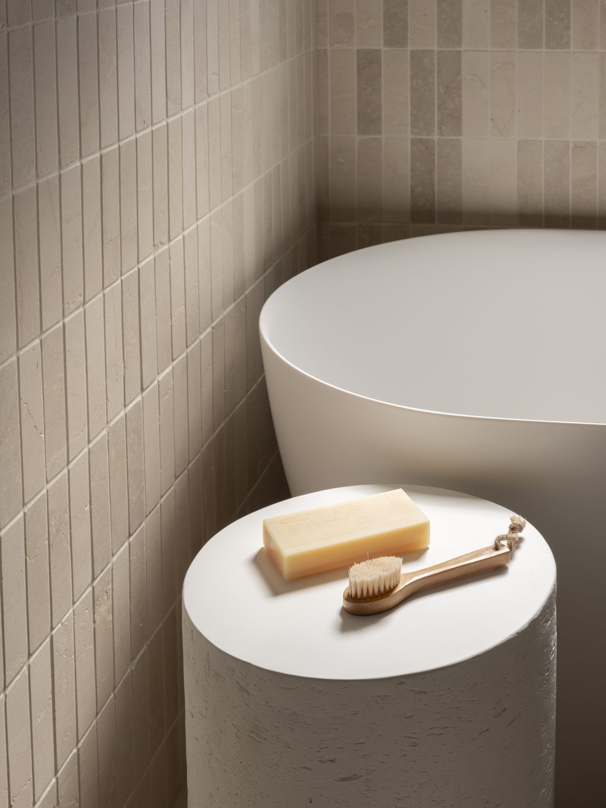Freestanding bath and tiled wall in a renovated Gold Coast bathroom