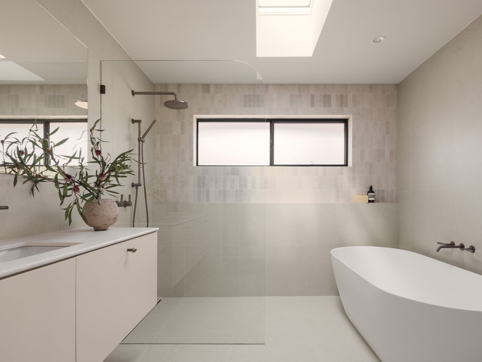 Spacious Gold Coast bathroom renovation with a freestanding bath, floating vanity and walk-in shower