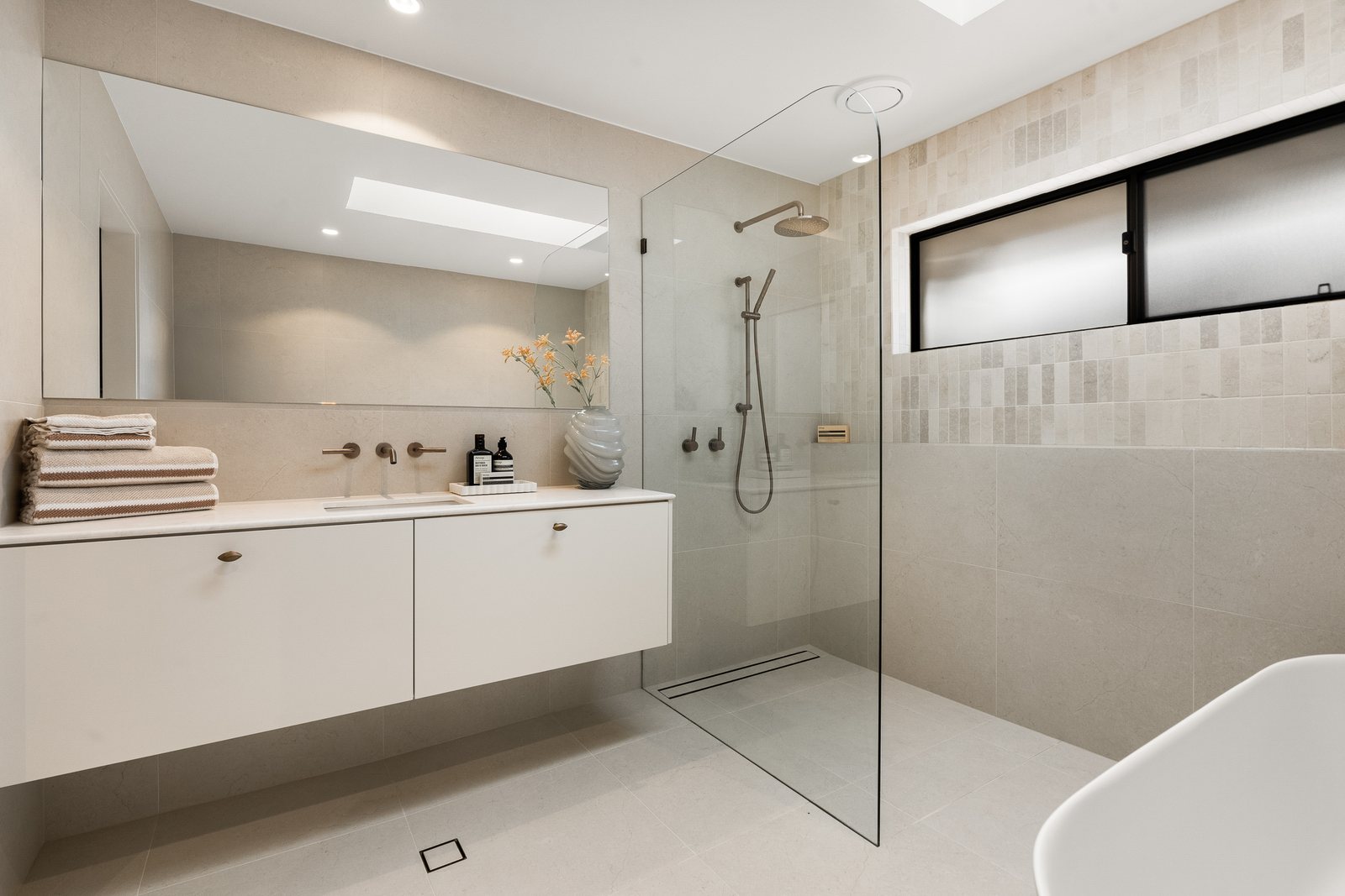 Walk-in shower and floating vanity in a Gold Coast bathroom renovation